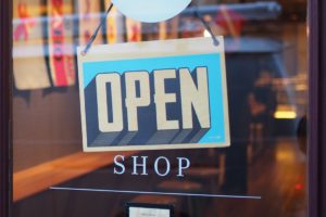 An open sign on a door. 