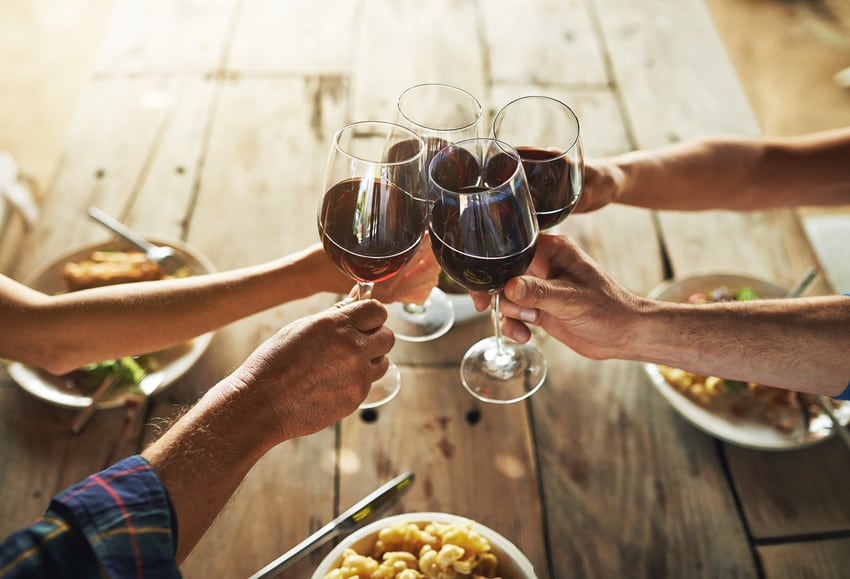 Friends drinking wine together.