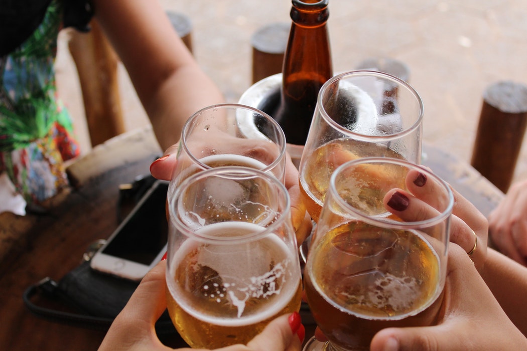 A group of people drinking beer.