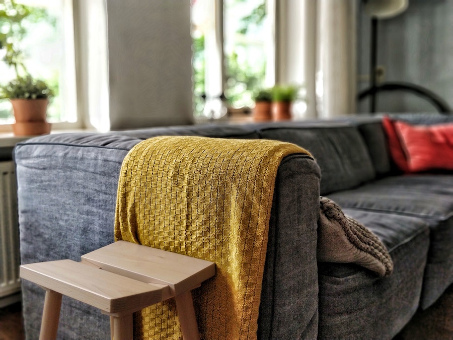 Couch with pillows and blanket