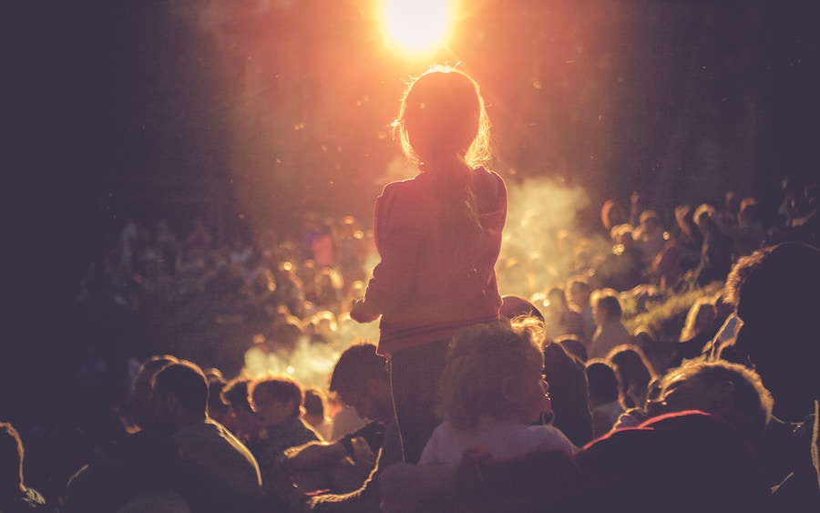 Child in crowd at night