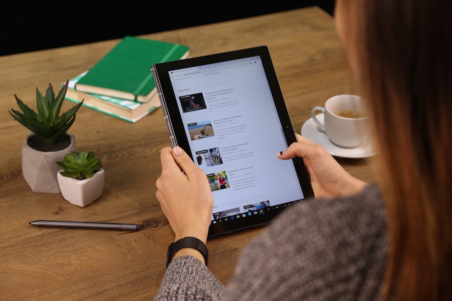 Woman researching 2020 Buying Trends on a tablet